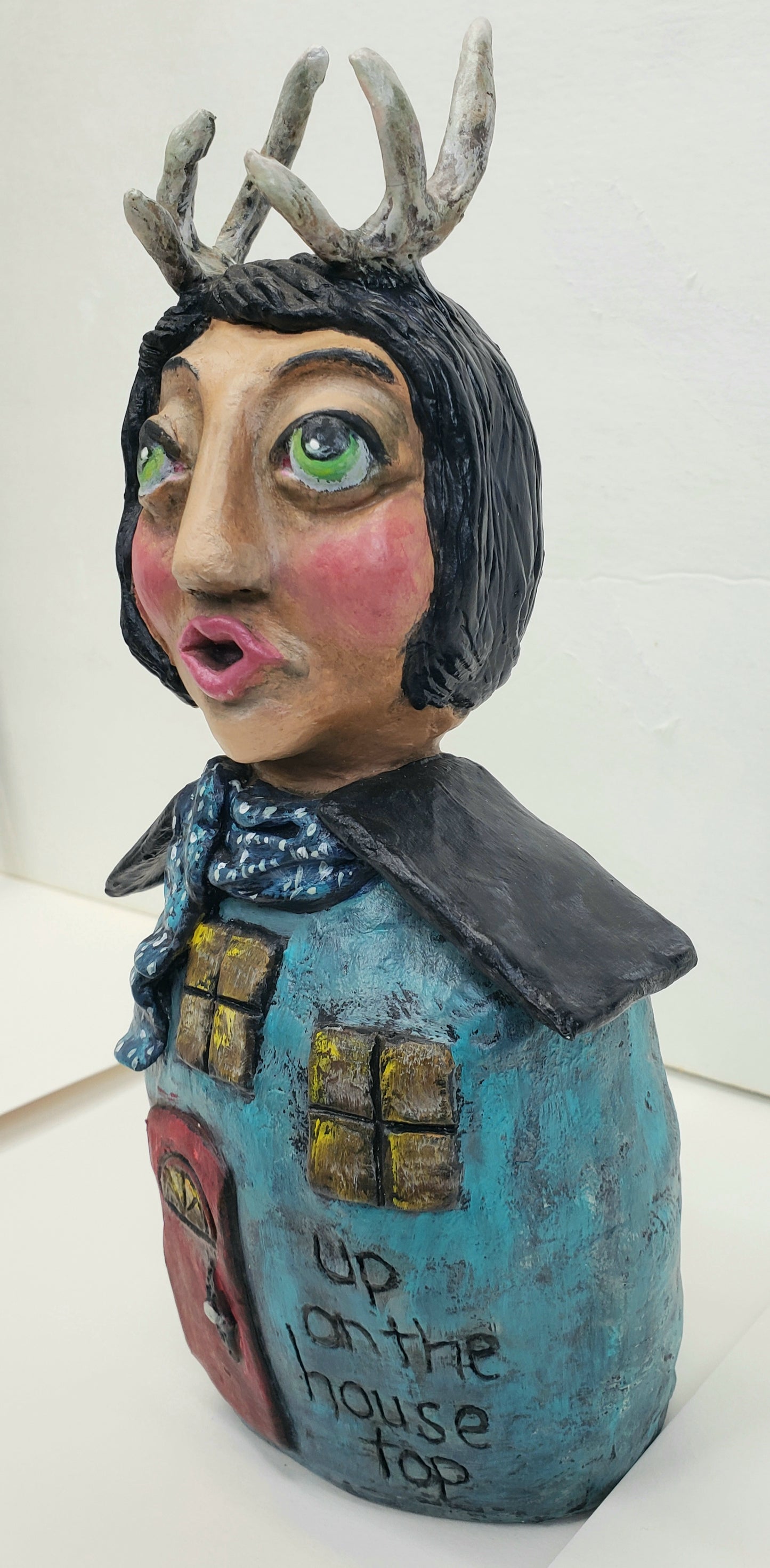Handmade Paper clay Doll with antlers Up on the house top carved into her house themed body