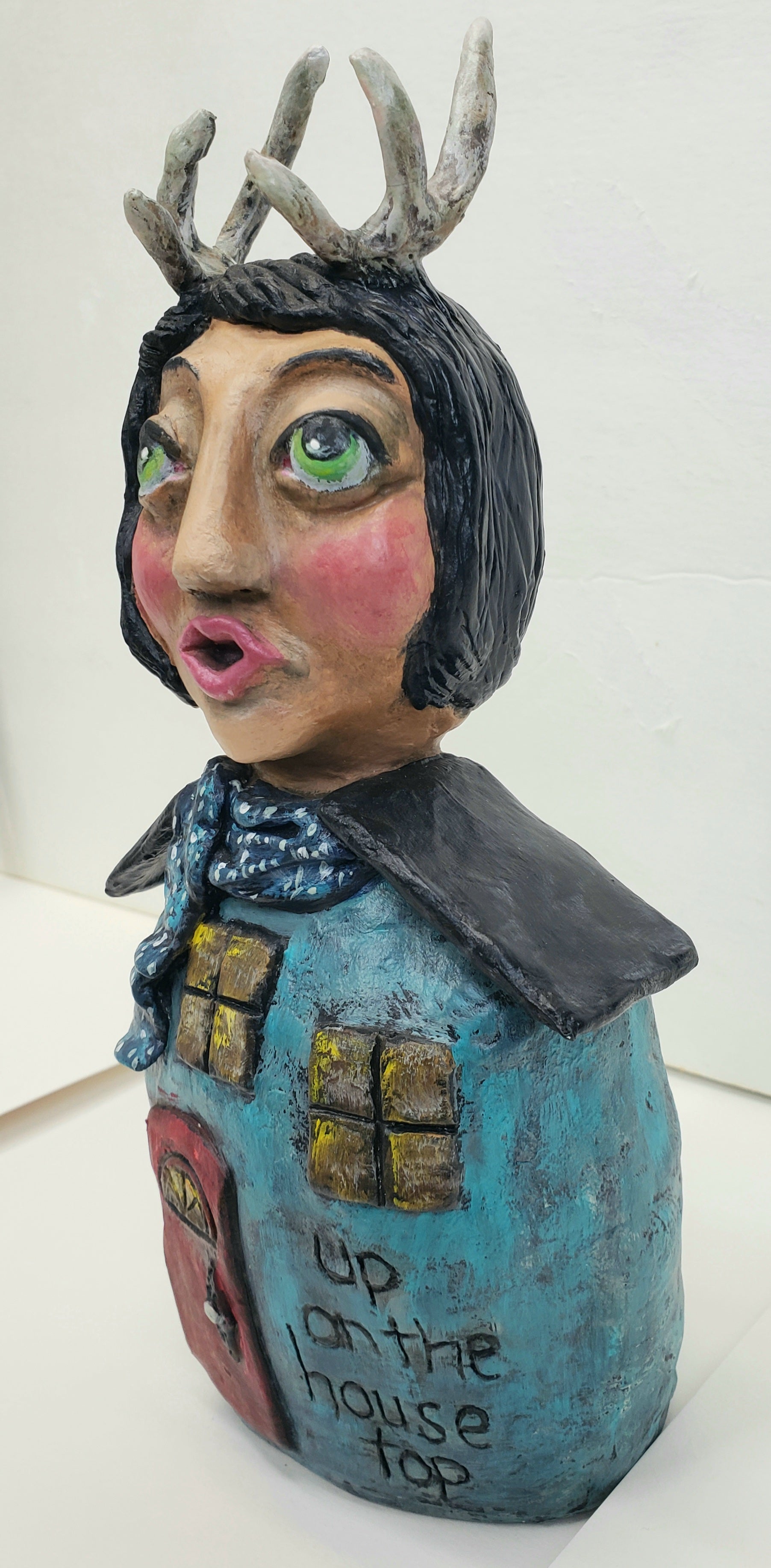Handmade Paper clay Doll with antlers Up on the house top carved into her house themed body