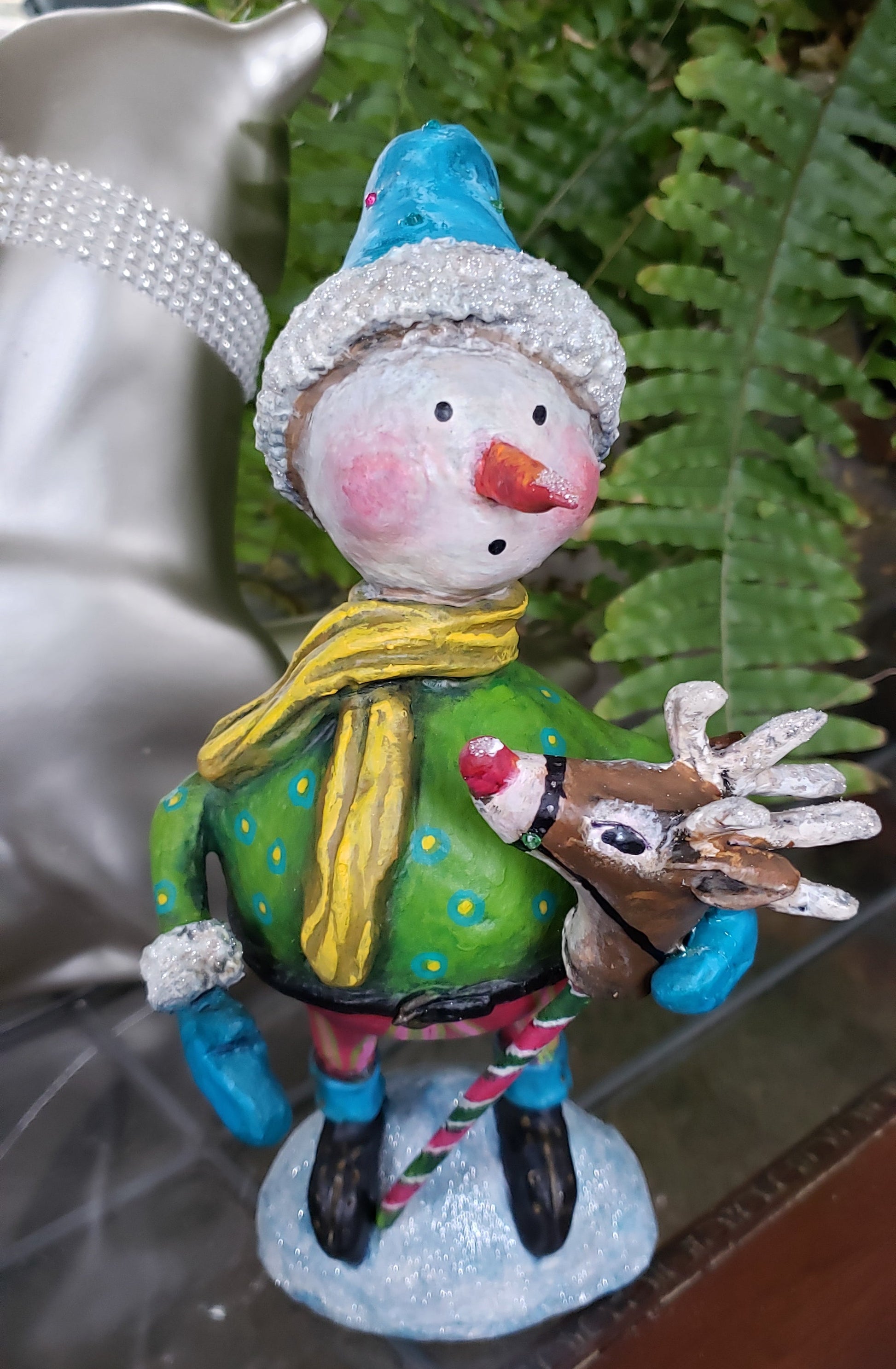 Decorative figurine of a snowman and reindeer 
