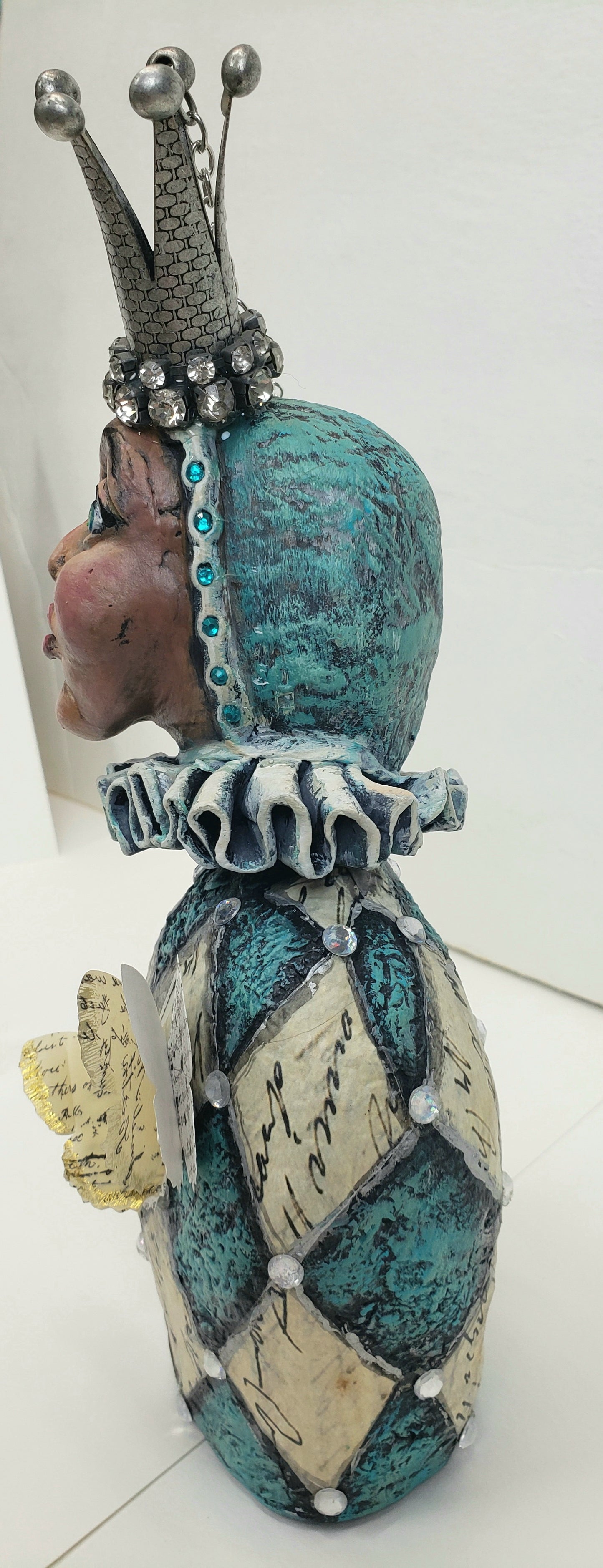 Paper clay Jester bust with diamond shapes from paper with written words hand made paper clay doll