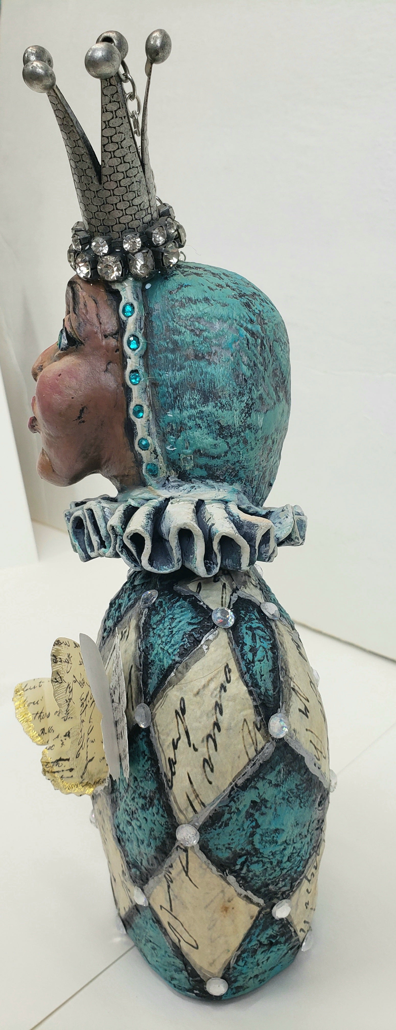 Paper clay Jester bust with diamond shapes from paper with written words hand made paper clay doll