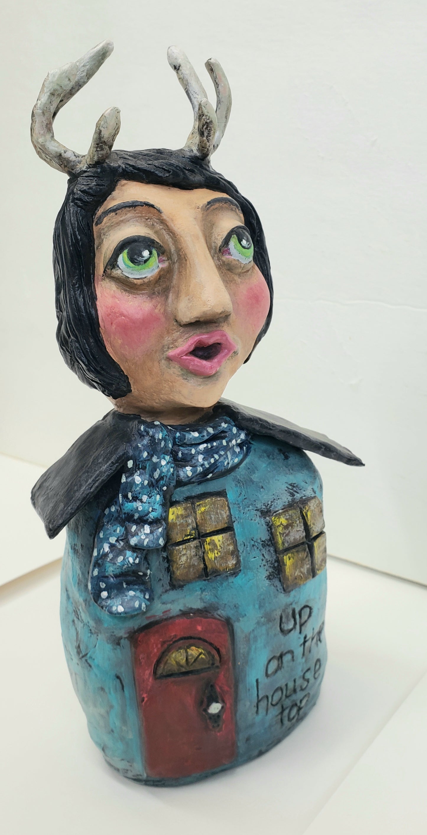 Handmade Paper clay Doll with antlers Up on the house top carved into her house themed body