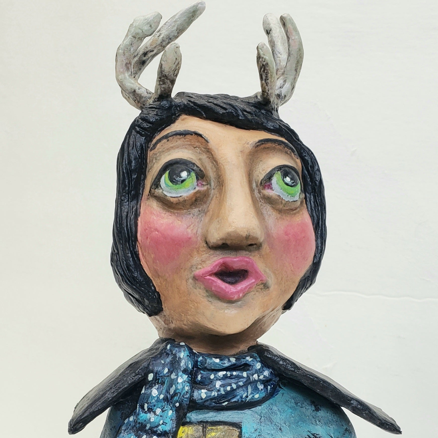 Handmade Paper clay Doll with antlers Up on the house top carved into her house themed body standing Christmas decoration