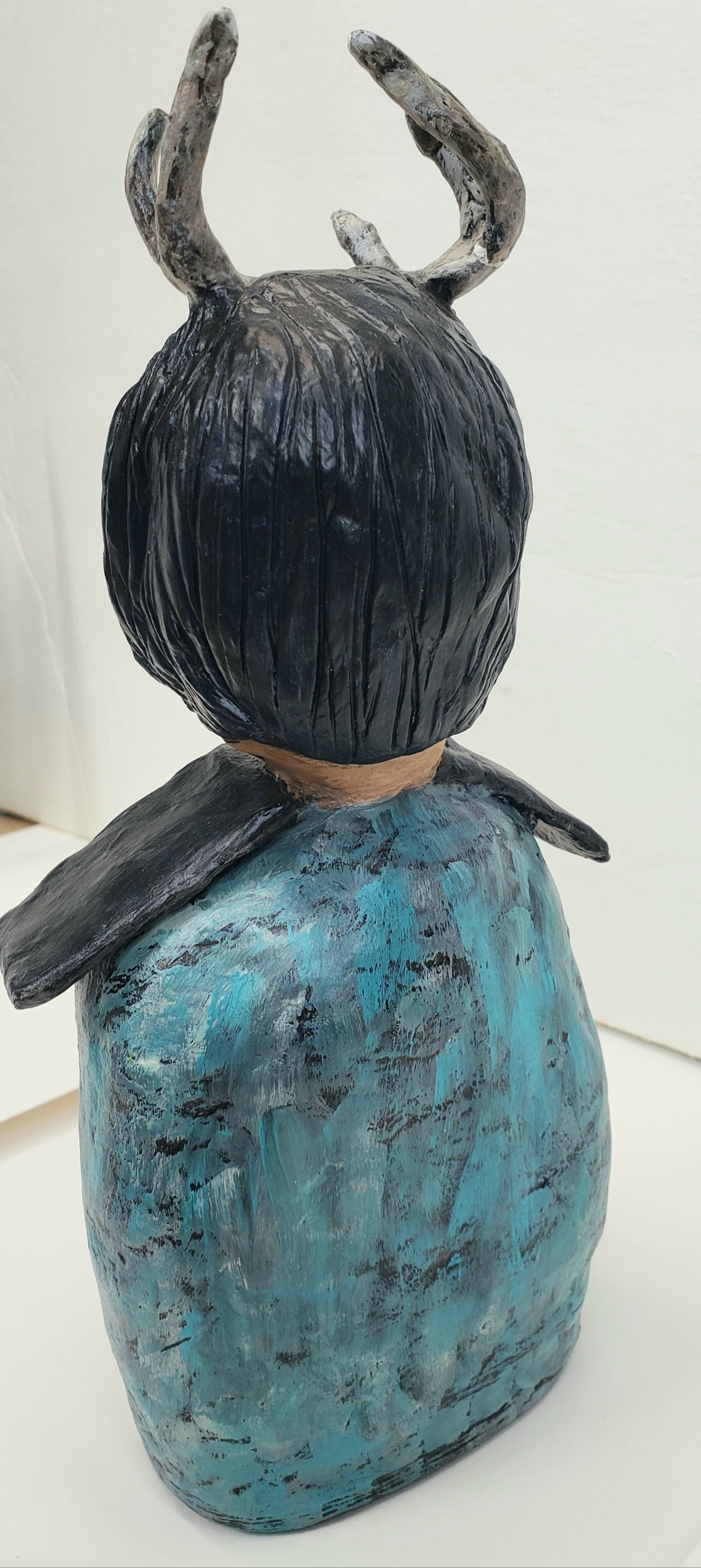 Handmade Paper clay Doll with antlers Up on the house top carved into her house themed body standing Christmas decoration