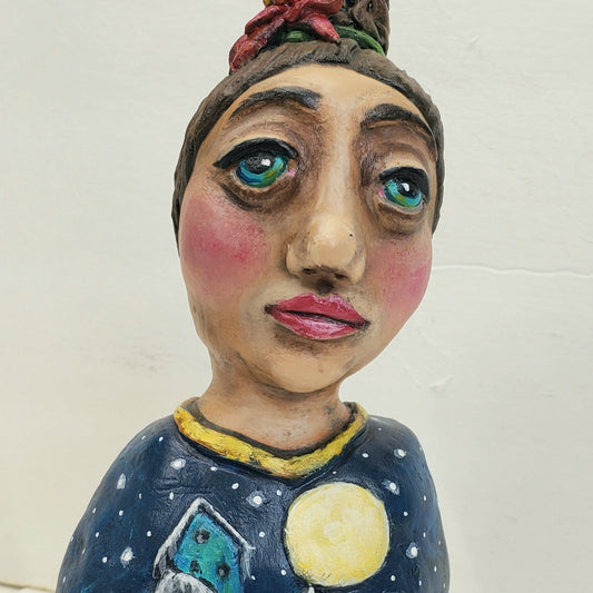 paper clay figurine with a snowy village design and 'Silent Night' text 